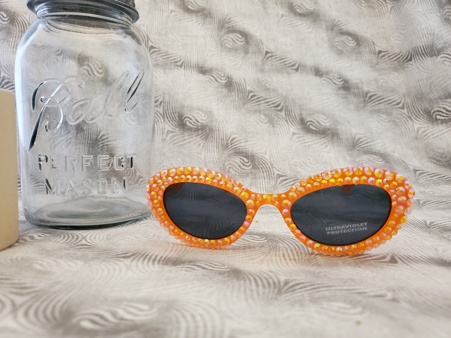 Retro 80s-Inspired Orange Sunglasses with Sparkling Rhinestones